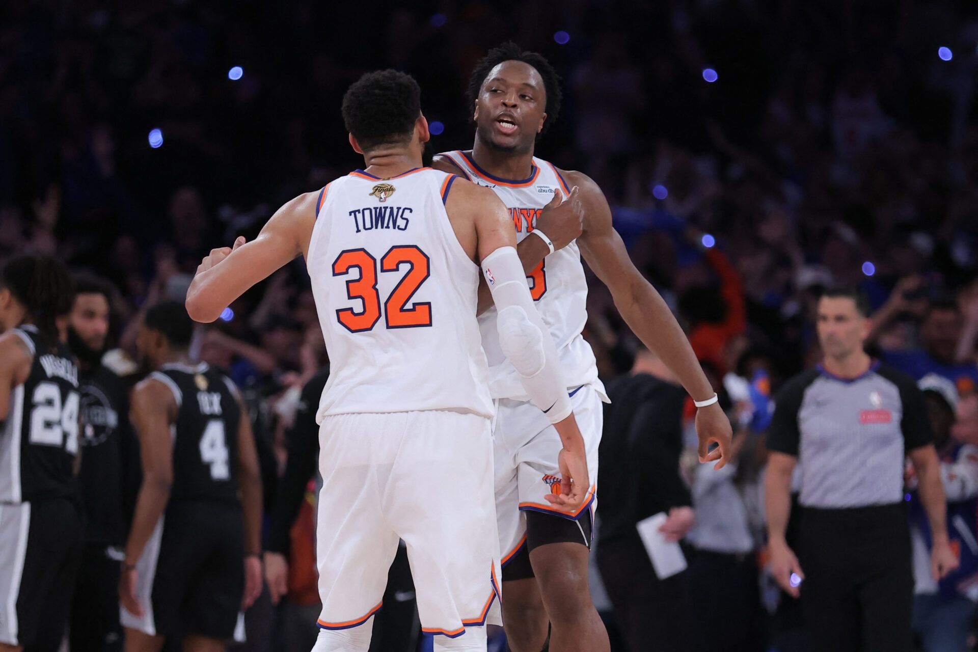 New York Knicks forward Og Anunoby (8) and center Karl-Anthony Towns (32) react in the fourth quarter against the San Antonio Spurs during game four of the 2026 NBA Finals at Madison Square Garden.