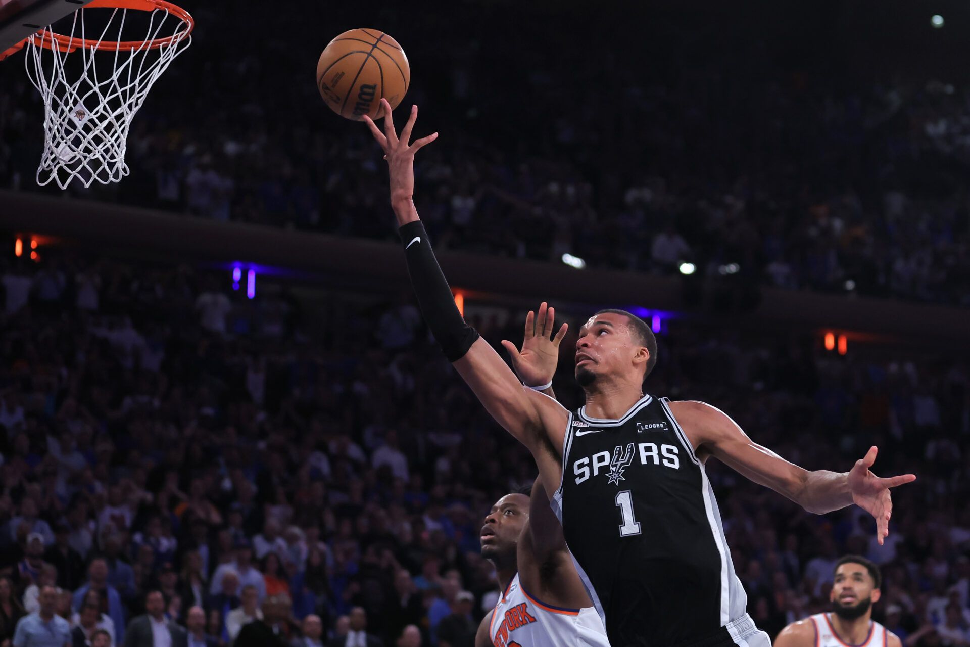 San Antonio Spurs forward Victor Wembanyama (1) shoots against New York Knicks forward Og Anunoby (8) in the fourth quarter during game four of the 2026 NBA Finals at Madison Square Garden.