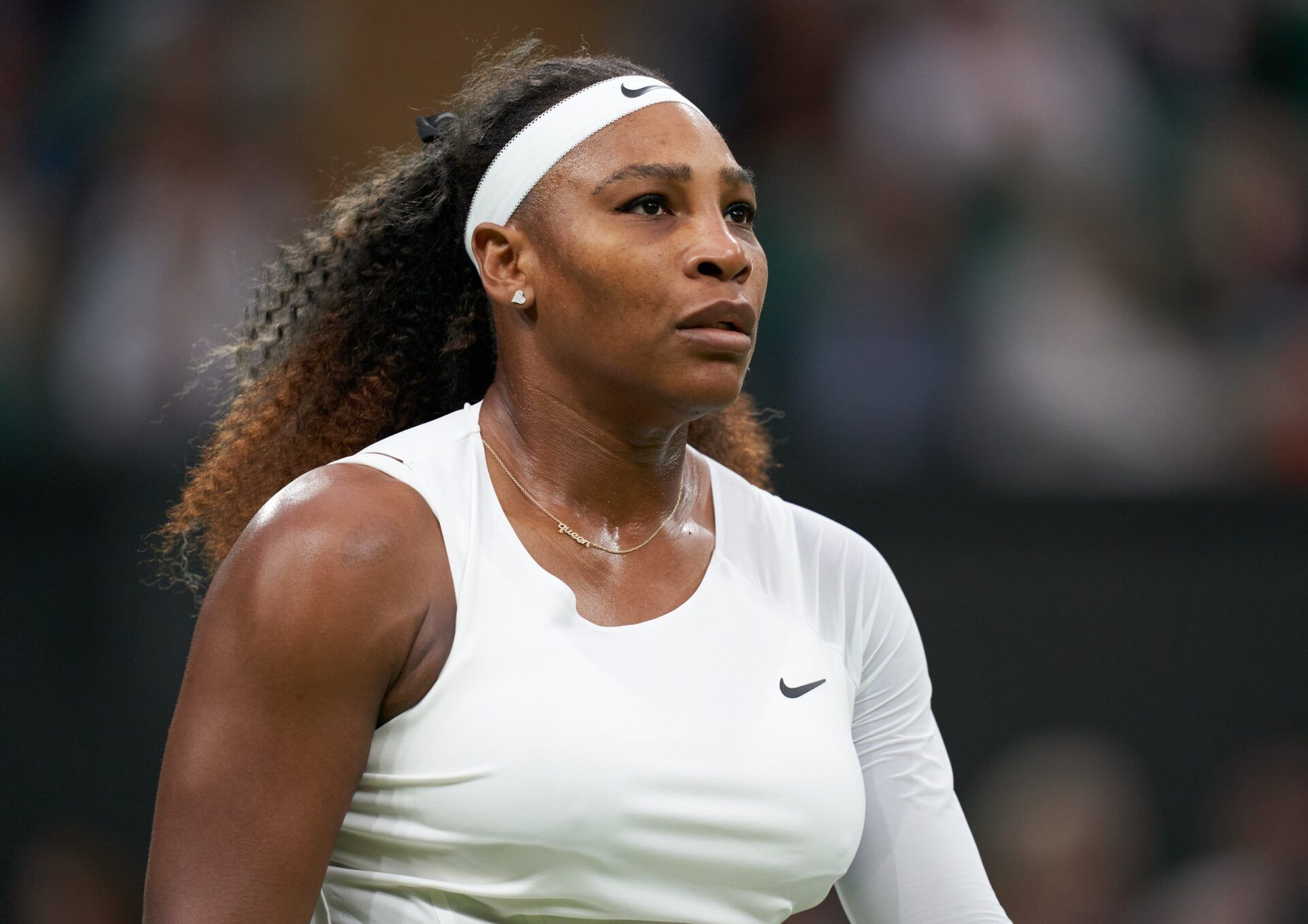 Serena Williams (USA) reacts while playing Aliaksandra Sasnovich (BLR) in first round ladies singles on centre court at All England Lawn Tennis and Croquet Club.