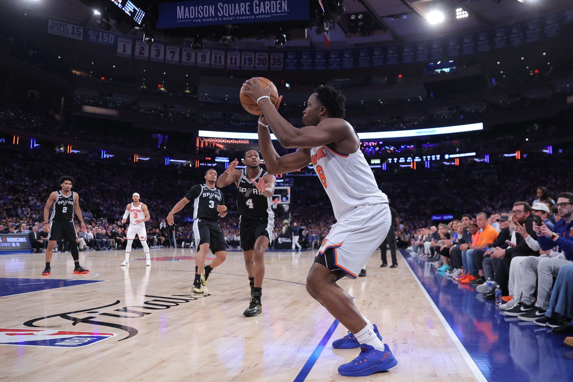 New York Knicks forward Og Anunoby (8) shoots against San Antonio Spurs guard De'aaron Fox (4) in the second quarter during game four of the 2026 NBA Finals at Madison Square Garden.