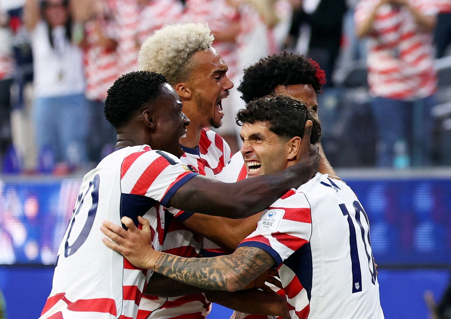 Soccer Football - FIFA World Cup 2026 - Group D - United States v Paraguay - Los Angeles Stadium, Inglewood, California, U.S. - June 12, 2026 Christian Pulisic of the U.S. celebrates with teammates their first goal, an own goal scored by Paraguay's Damian Bobadilla IMAGN IMAGES via Reuters/Kiyoshi Mio     TPX IMAGES OF THE DAY