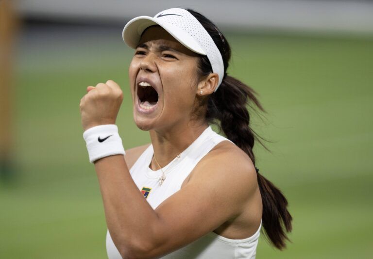 Emma Raducanu of Great Britain reacts to a point during her match against Aryna Sabalenka on day five at the All England Lawn Tennis and Croquet Club.