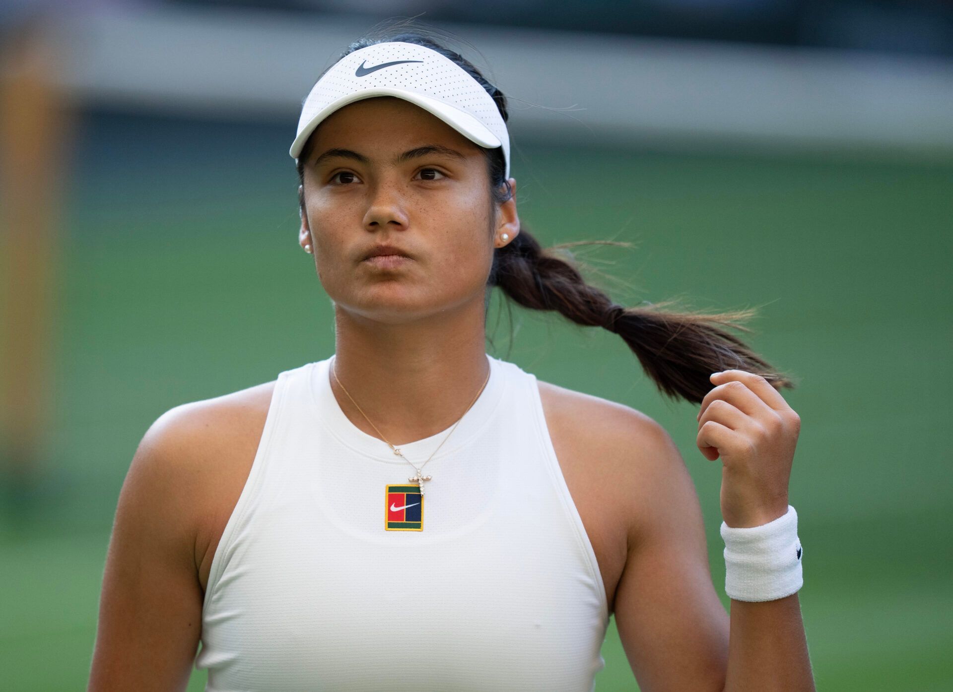 Emma Raducanu of Great Britain during her match against Marketa Vondrousova of the Czech Republic on day three at the All England Lawn Tennis and Croquet Club.