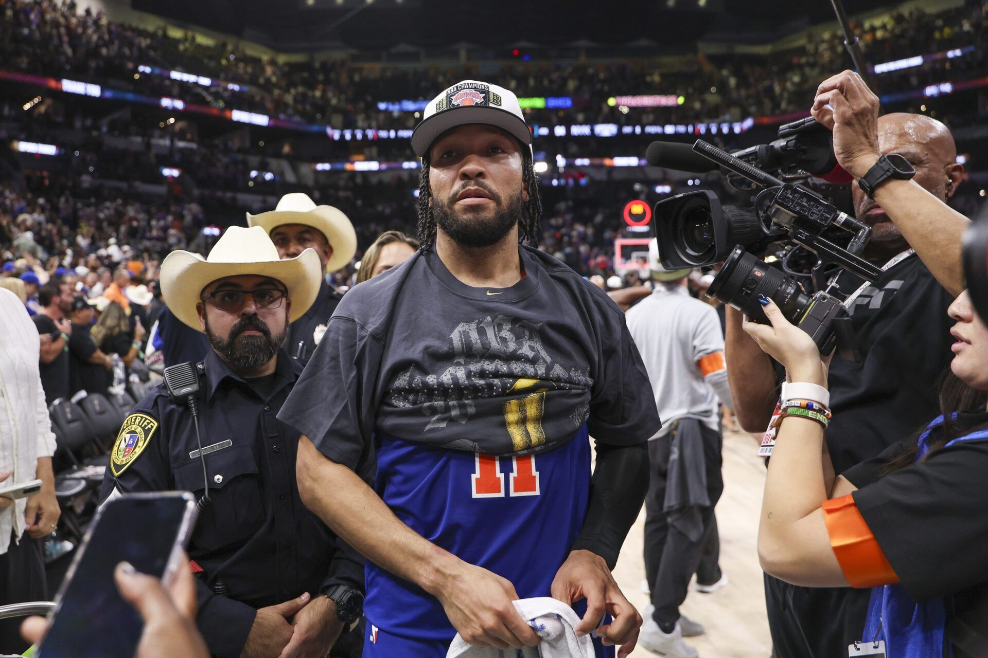 New York Knicks guard Jalen Brunson (11) walks off the court after the Knicks defeat the San Antonio Spurs during game five of the 2026 NBA Finals at Frost Bank Center.