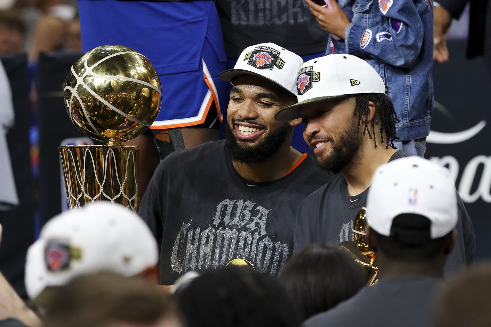 New York Knicks center Karl-Anthony Towns (32) and guard Jalen Brunson (11) celebrates with his teammates after the Knicks defeat the San Antonio Spurs during game five of the 2026 NBA Finals at Frost Bank Center.