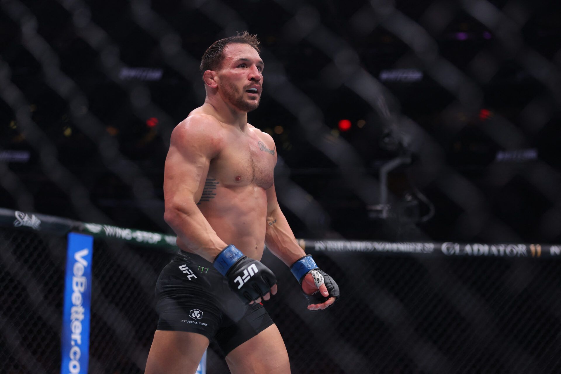 Charles Oliveira (red gloves) fights Michael Chandler (blue gloves) in the lightweight bout during UFC 309 at Madison Square Garden.