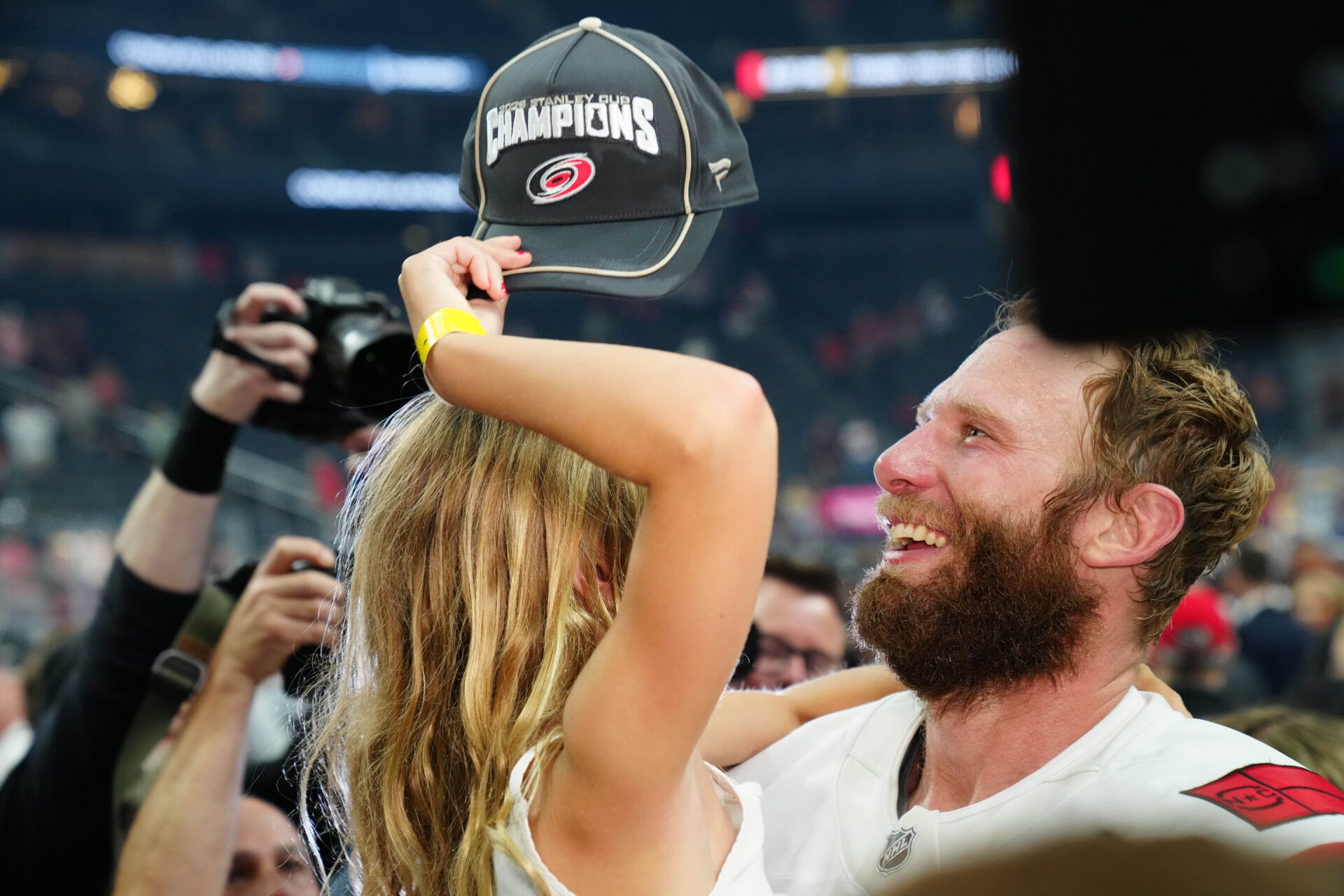 Carolina Hurricanes center Jordan Staal (11) celebrates with his daughter winning the the Stanley Cup after defeating the Vegas Golden Knights in game six of the 2026 Stanley Cup Final at T-Mobile Arena.