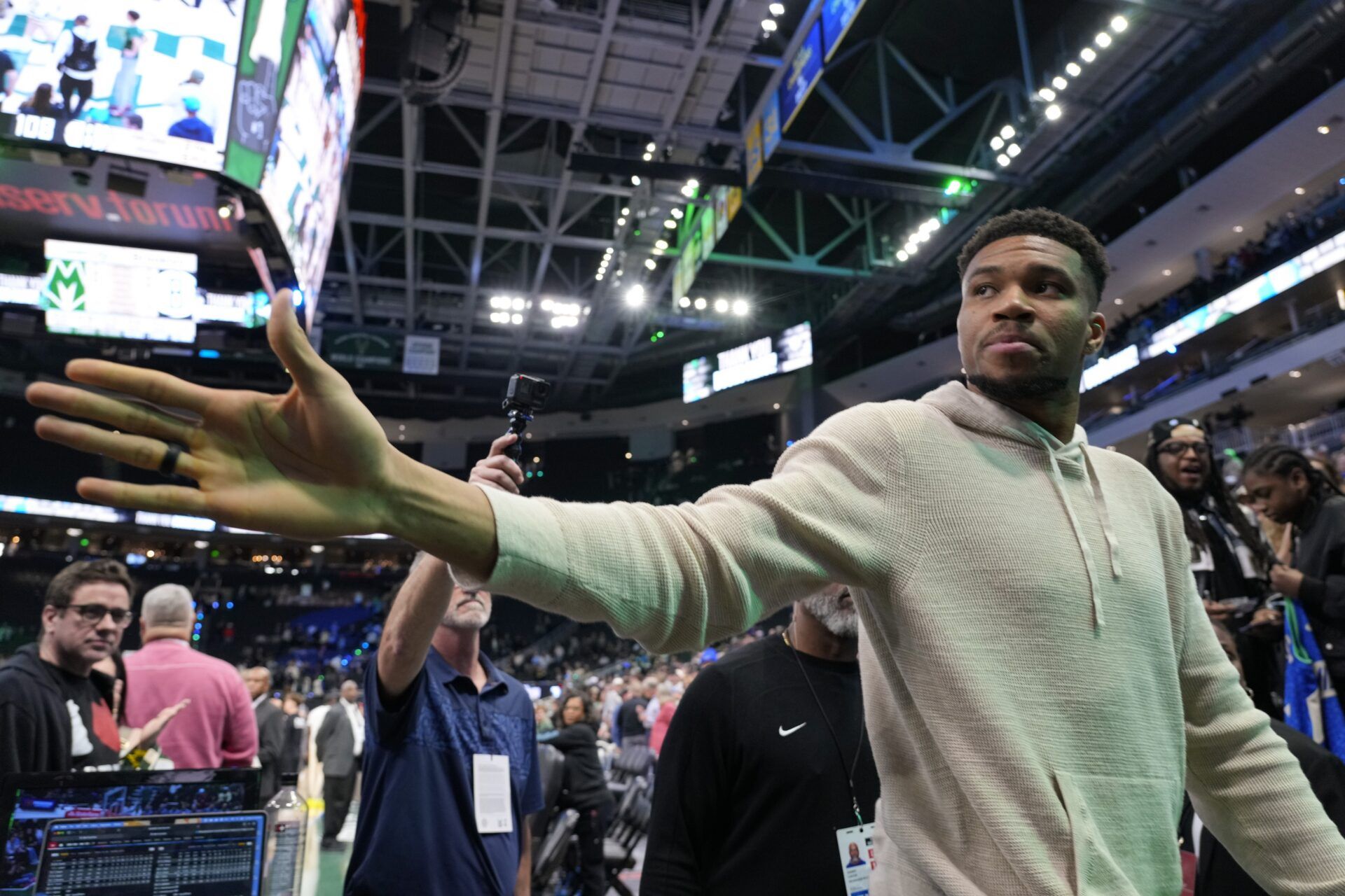 Milwaukee Bucks forward Giannis Antetokounmpo (34) waves towards fans following the game against the Brooklyn Nets at Fiserv Forum.