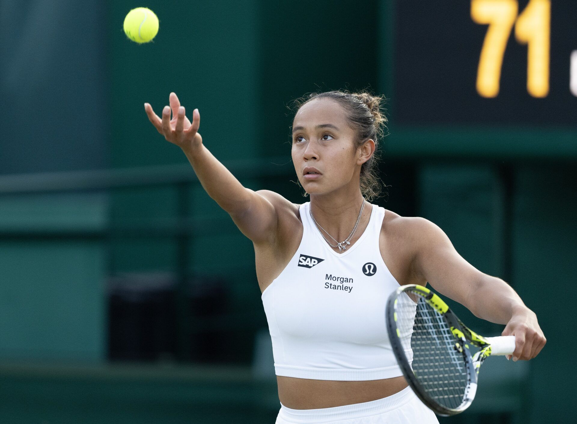 London,United Kingdom; Leylah Fernandez of Canada tosses the ball to serve during her match.