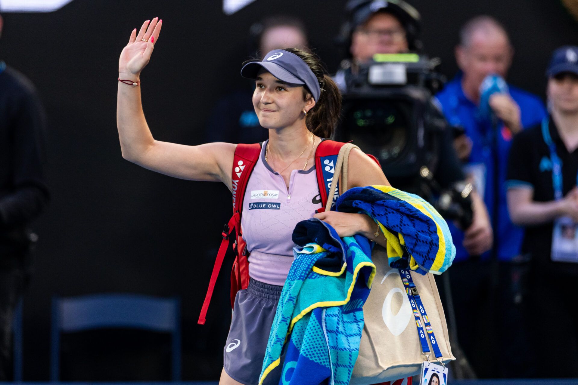 Eva Lys of Germany exits during her match against Iga Swiatek of Poland in the fourth round of the women's singles at the 2025 Australian Open at Melbourne Park.