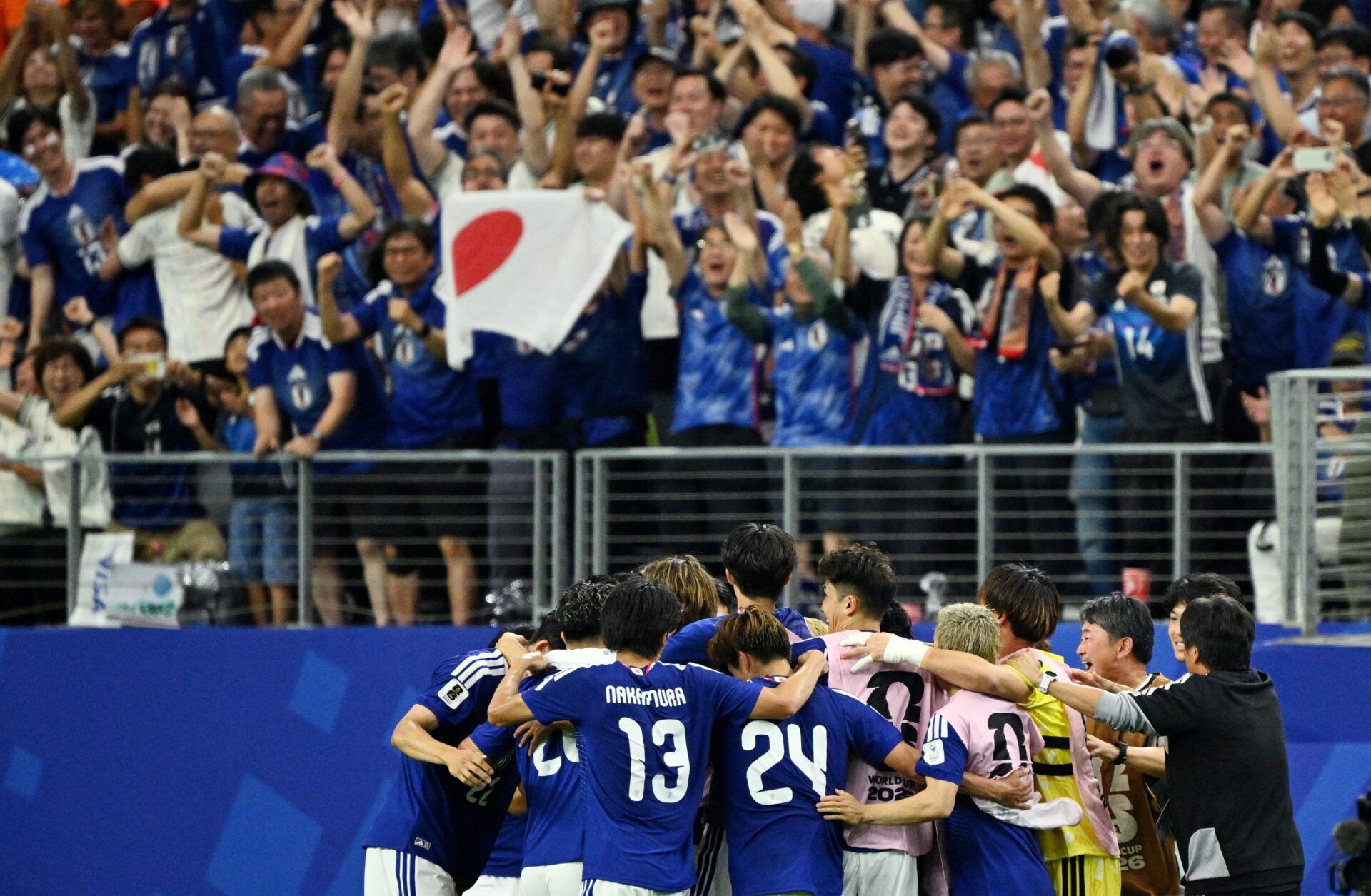 Japan's Daichi Kamada celebrates scoring their second goal.