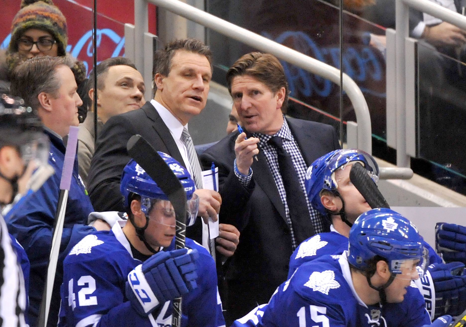 Toronto Maple Leafs head coach Mike Babcock (right) gestures as he speaks with assistant coach Jim Hiller during a time out against Columbus Blue Jackets at Air Canada Centre.