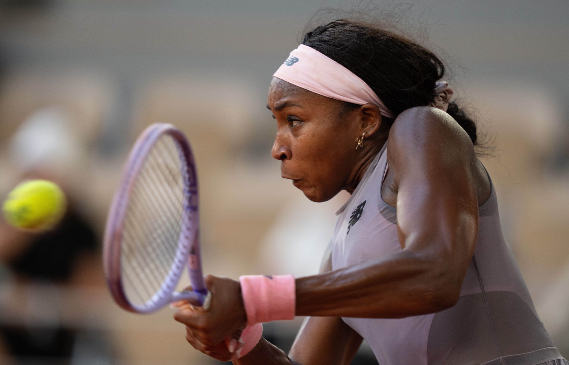 Coco Gauff of the United States returns a shot during her match against Anastasia Potapova of Austria on day seven at Stade Roland Garros.