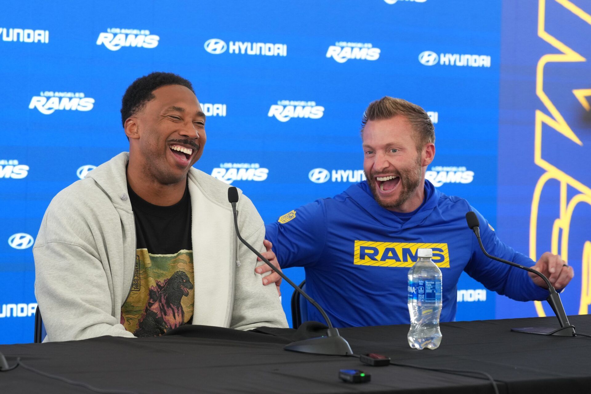 Los Angeles Rams defensive end Myles Garrett (left) and coach Sean McVay react at press conference at Rams Practice Facility.