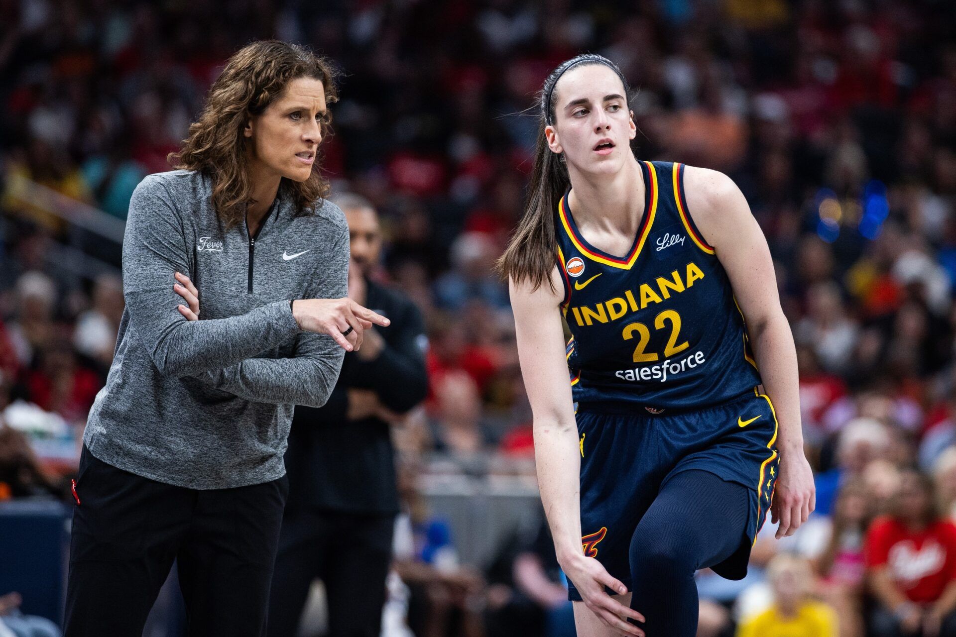 Indiana Fever head coach Stephanie White and guard Caitlin Clark (22) in the first half against the Chicago Sky at Gainbridge Fieldhouse.
