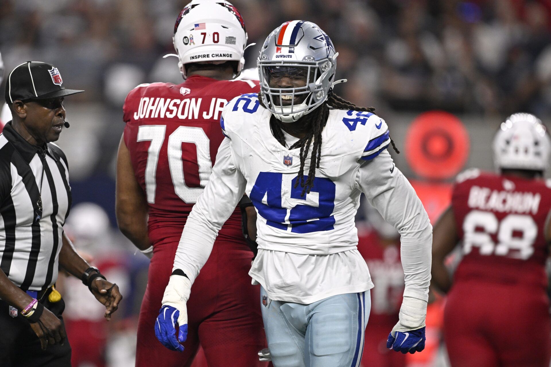 Dallas Cowboys defensive end Jadeveon Clowney (42) reacts after a sack against Arizona Cardinals quarterback Jacoby Brissett (7) in the first half at AT&T Stadium.
