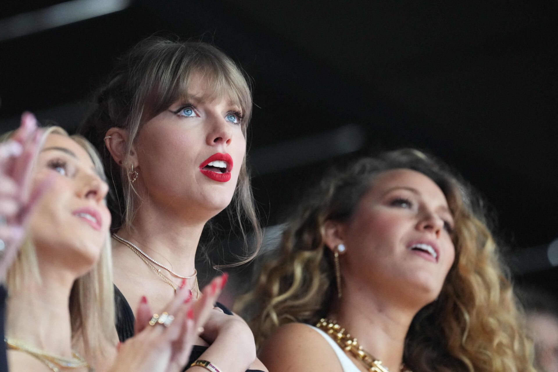 Recording artist Taylor Swift is pictured with American actress Blake Lively (right) react during the first quarter of Super Bowl LVIII at Allegiant Stadium.