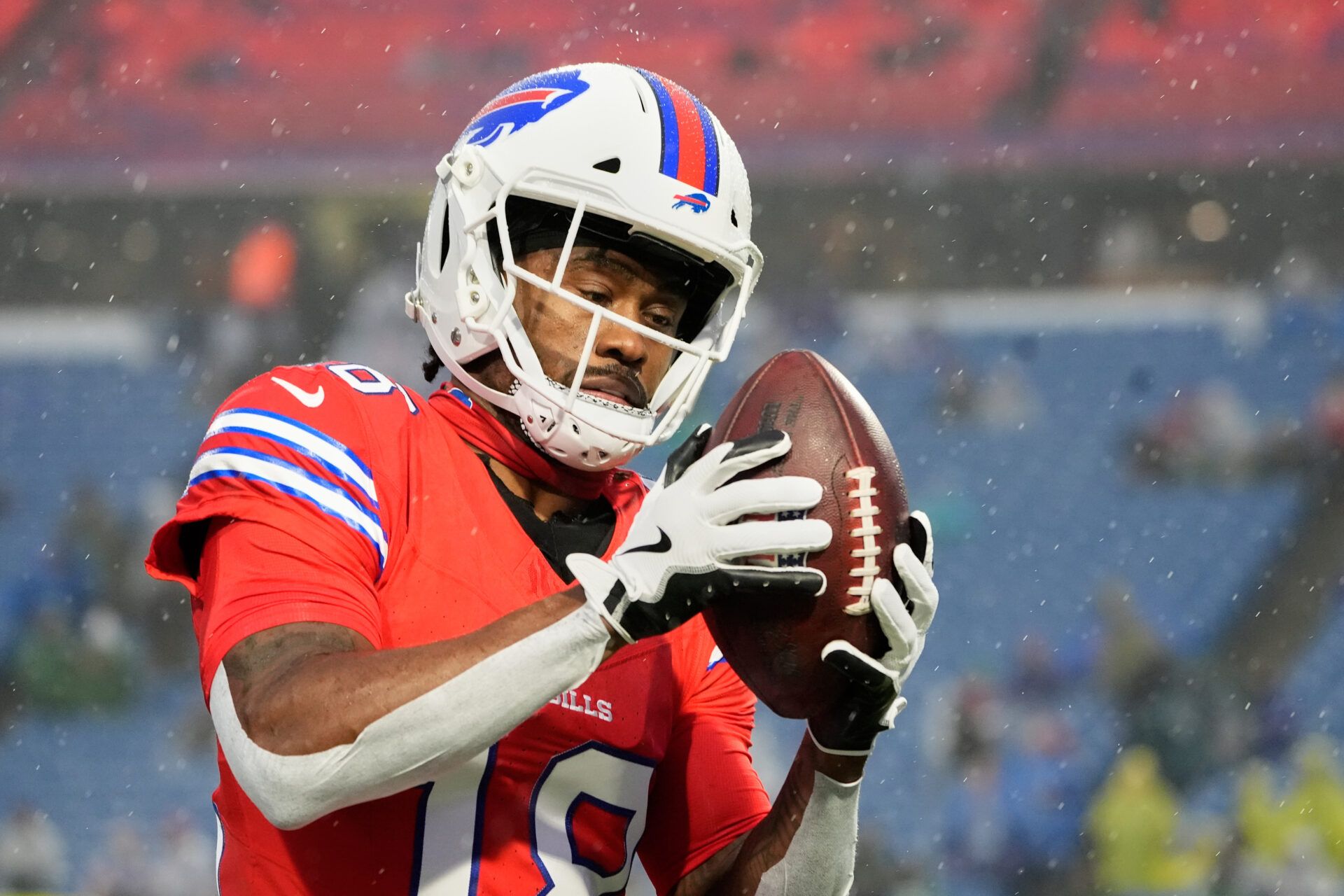 Buffalo Bills wide receiver Brandin Cooks (18) warms up in the rain before the game against the Philadelphia Eagles at Highmark Stadium.