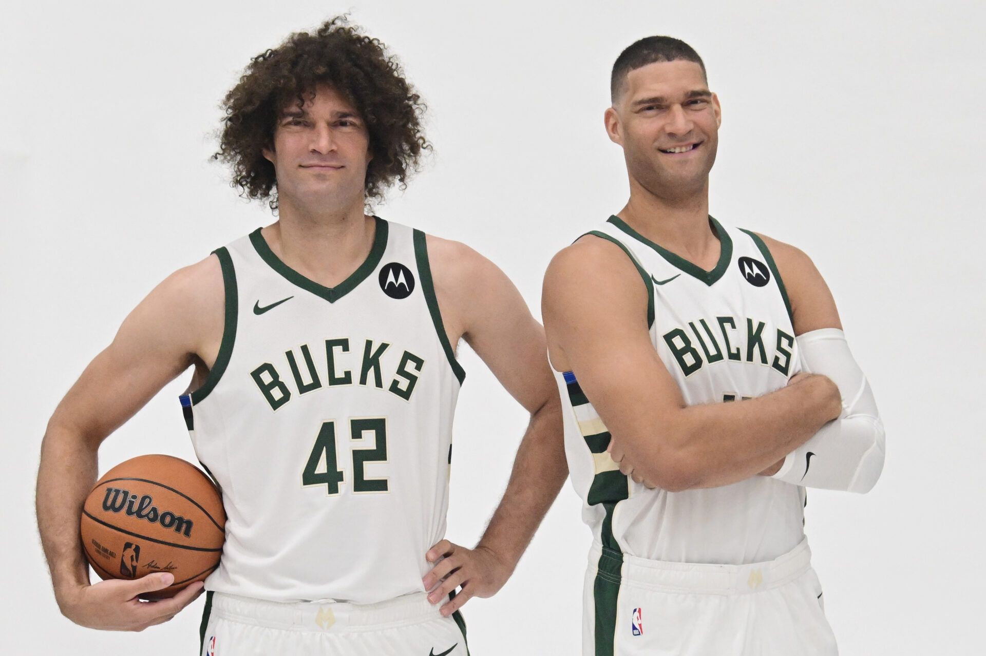 Milwaukee Bucks center Brook Lopez (11) and center Robin Lopez (42) pose for pictures during media day in Milwaukee.
