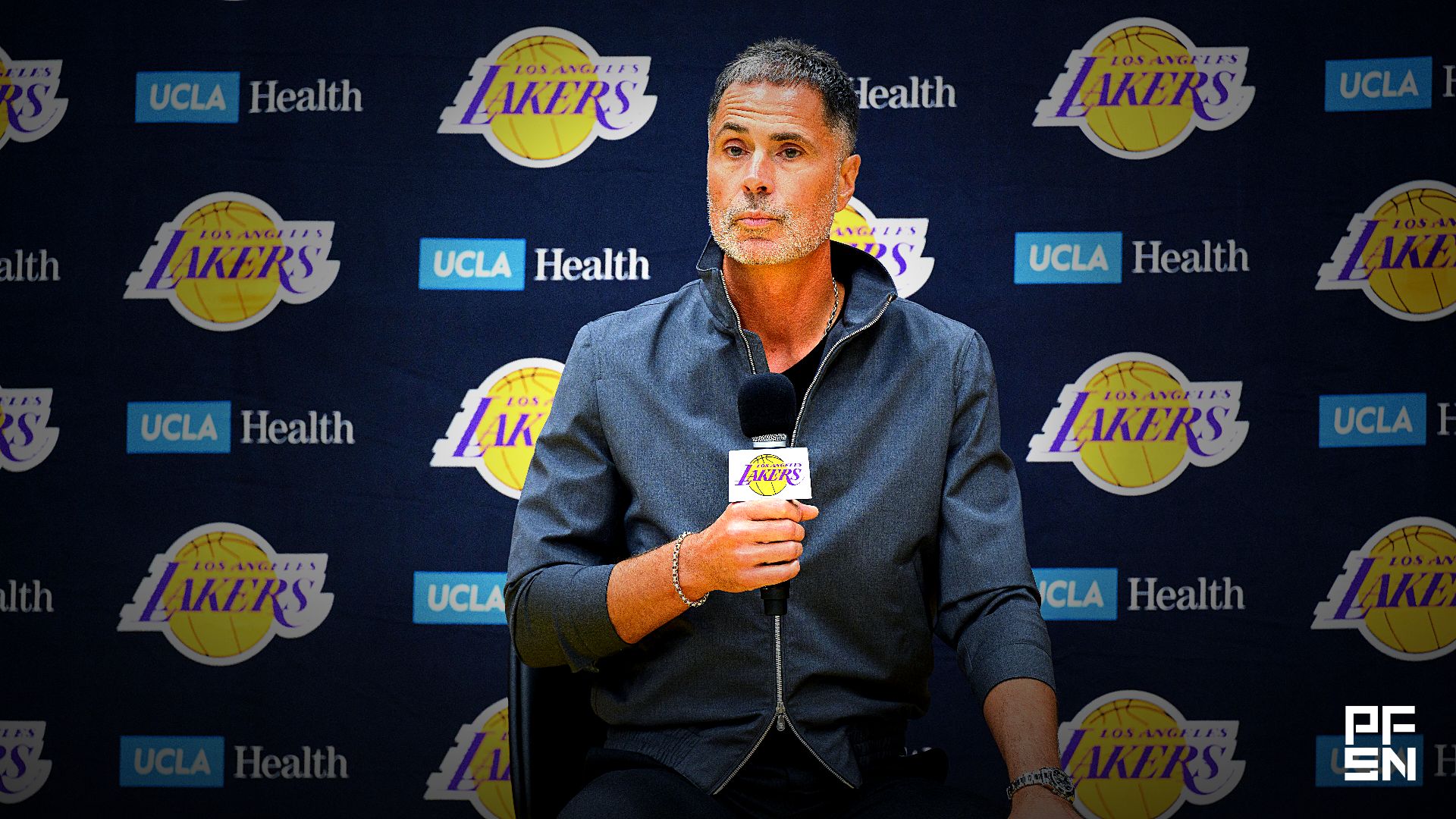 Los Angeles Lakers general manager Rob Pelinka, left, speaks during a press conference to preview the 2025-26 season at UCLA Health Training Center.