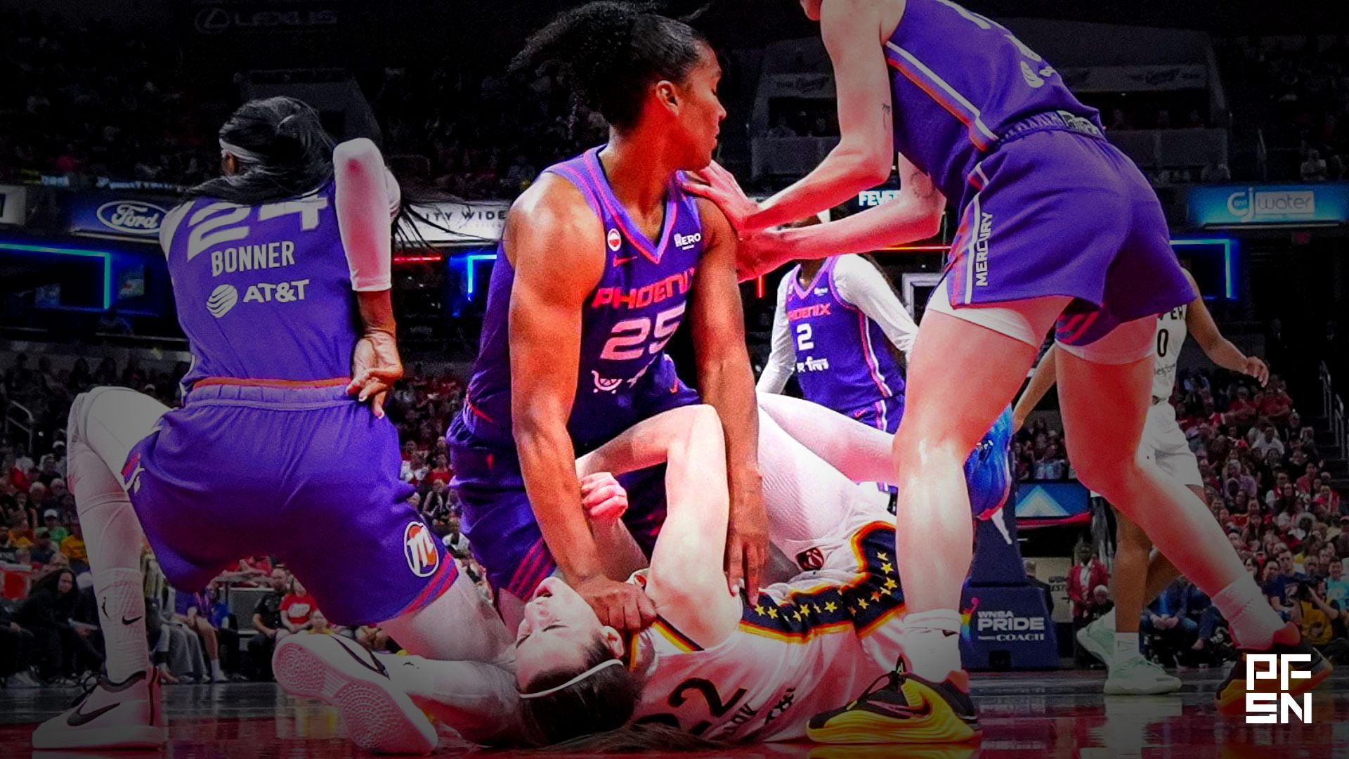 Phoenix Mercury forward Alyssa Thomas (25) scrambles to get up over Indiana Fever guard Caitlin Clark (22) on Wednesday, June 24, 2026, during a game at Gainbridge Fieldhouse in Indianapolis. The Phoenix Mercury defeated the Indiana Fever, 111-109.