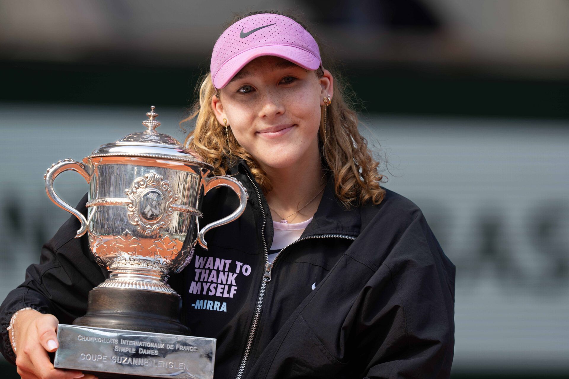 Mirra Andreeva poses with the trophy after winning the women’s singles final against Maja Chwalinska of Poland on day 14 at Stade Roland Garros.