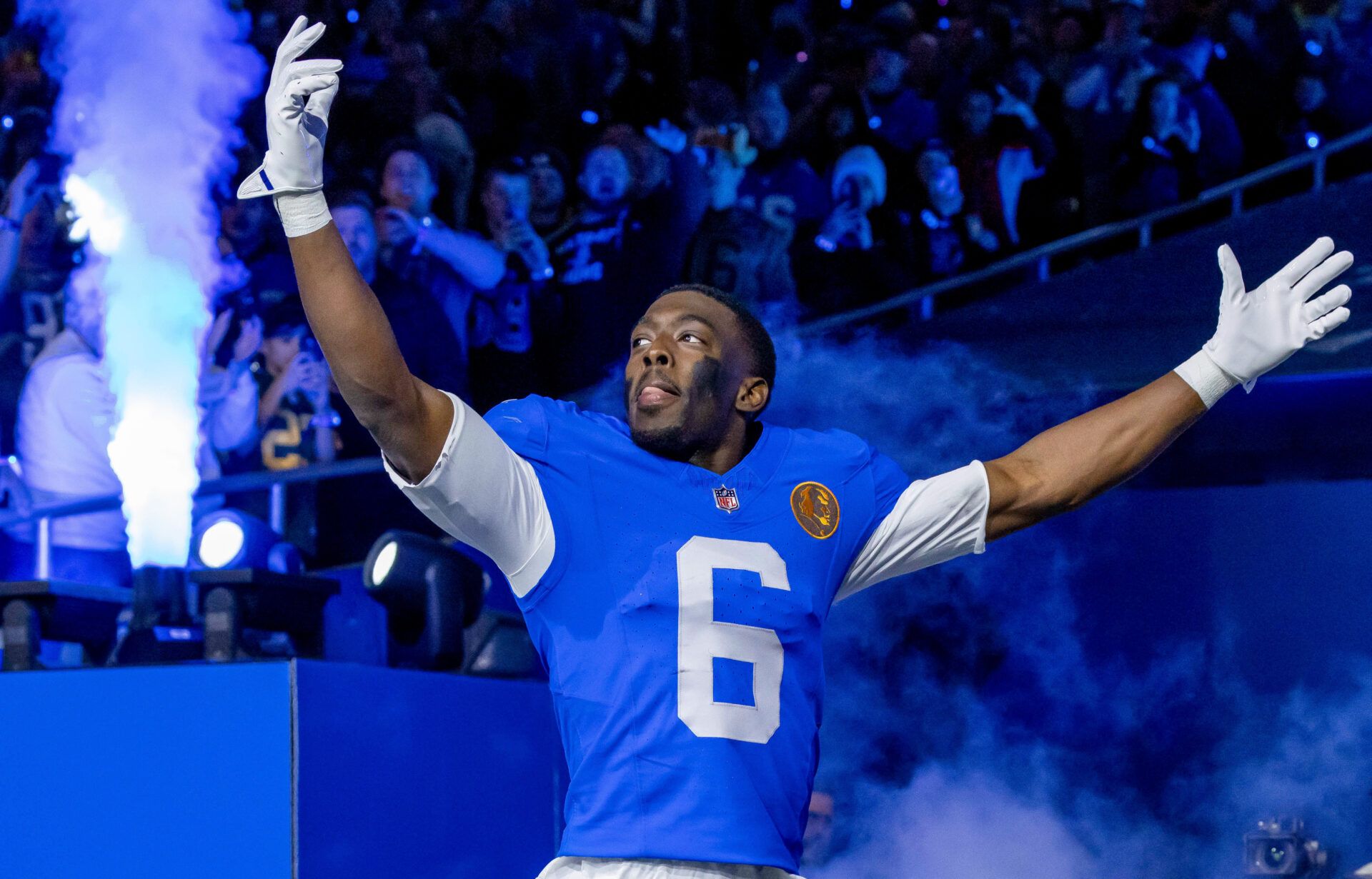Detroit Lions cornerback Terrion Arnold (6) runs onto the field prior to the game against the Green Bay Packers at Ford Field.