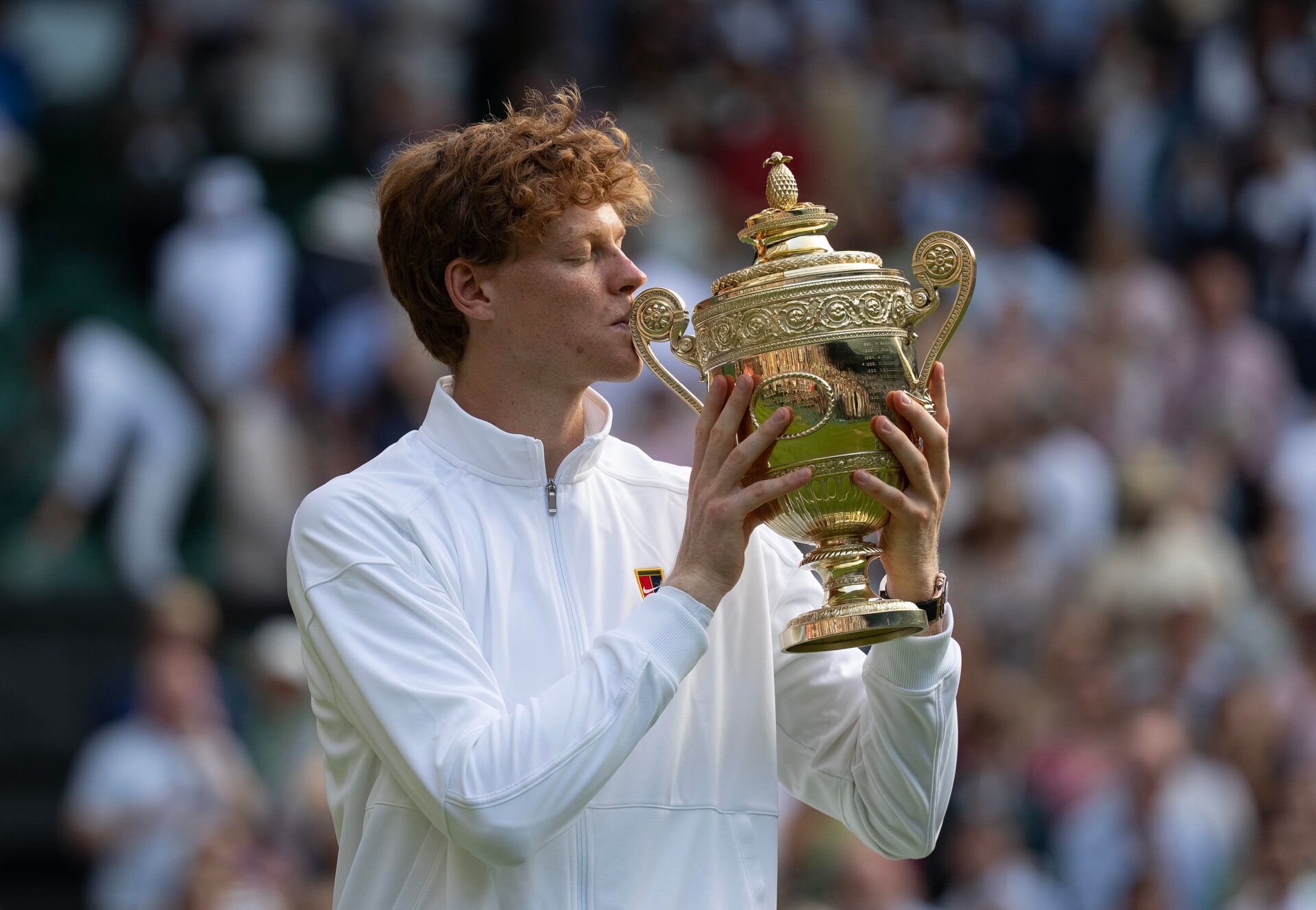 Jannik Sinner of Italy kisses the trophy after winning the menÕs singles final match against Carlos Alcaraz of Spain on day 14 at Wimbledon.