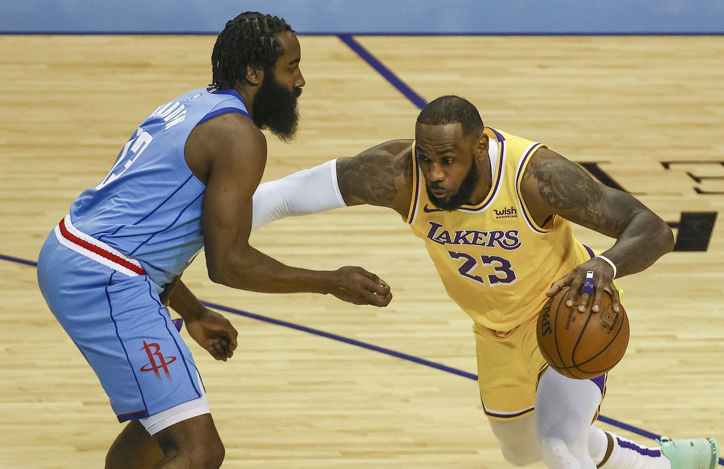 Los Angeles Lakers forward LeBron James (23) drives with the ball against Houston Rockets guard James Harden (13) during the first quarter at Toyota Center.