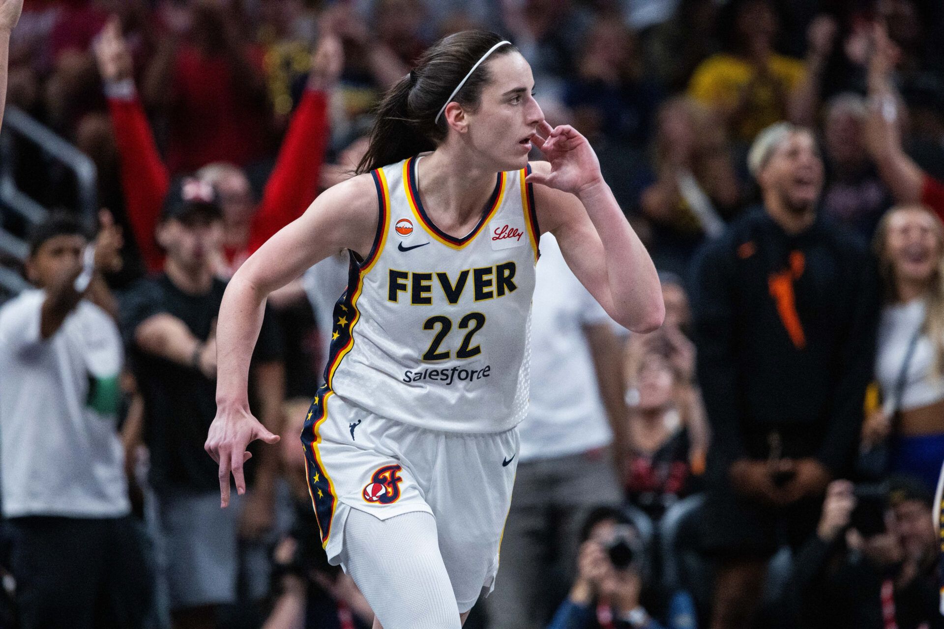 Indiana Fever guard Caitlin Clark (22) celebrates a made shot in the first half against the Phoenix Mercury at Gainbridge Fieldhouse.