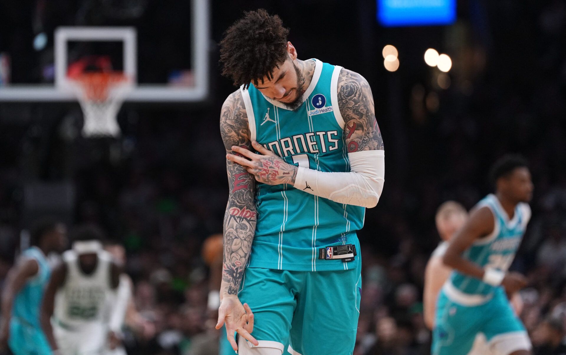 Charlotte Hornets guard LaMelo Ball (1) reacts after his three point basket against the Boston Celtics in the second quarter at TD Garden.