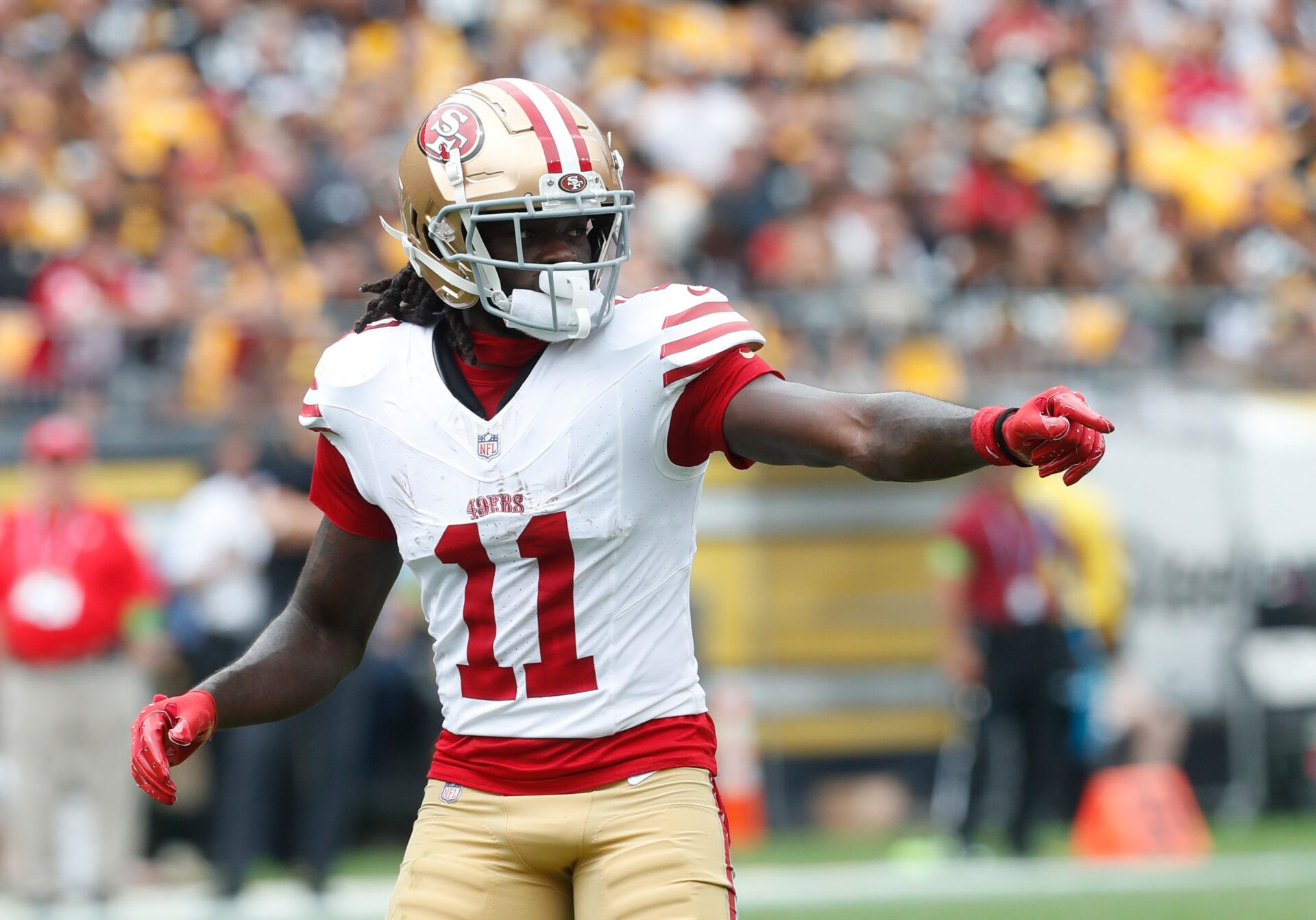 San Francisco 49ers wide receiver Brandon Aiyuk (11) gestures at the line of scrimmage against the Pittsburgh Steelers during the first quarter at Acrisure Stadium.