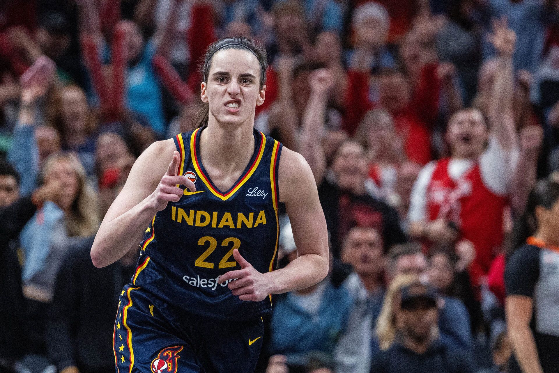 Indiana Fever guard Caitlin Clark (22) celebrates a made shot  in the first half against the Phoenix Mercury at Gainbridge Fieldhouse.
