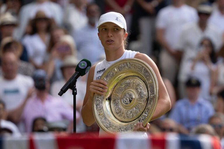 Iga Swiatek of Poland speaks at the trophy presentation after winning the women’s final match against Amanda Anisimova of the United States on day 13 at All England Lawn Tennis and Croquet Club.