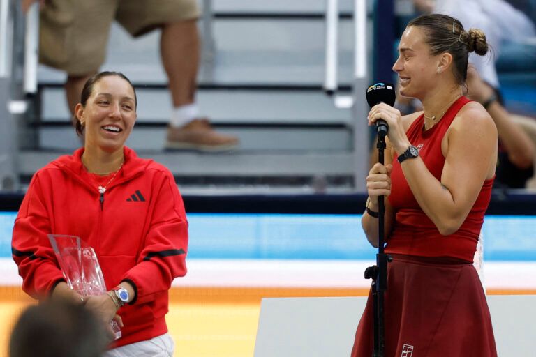 Aryna Sabalenka (R) jokes with Jessica Pegula (USA)(L) during her speech in the trophy presentation ceremony after their women's singles championship of the Miami Open at Hard Rock Stadium.