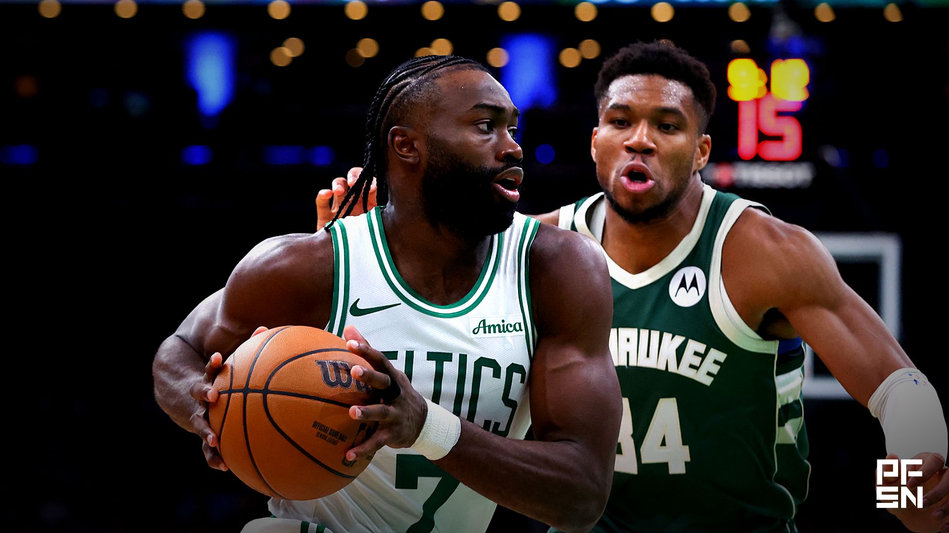 Boston Celtics forward Jaylen Brown (7) drives to the basket defended by Milwaukee Bucks forward Giannis Antetokounmpo (34) during the second half at TD Garden.