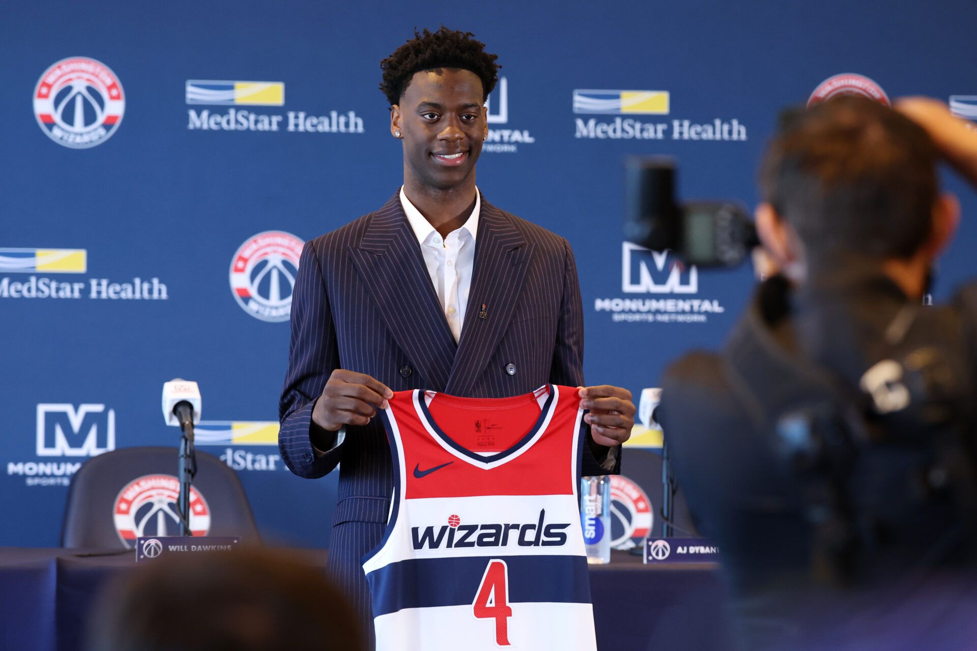 Washington Wizards first round draft pick and number one overall pick AJ Dybantsa poses for a photo with his jersey during a press conference at InterContinental Hotel.