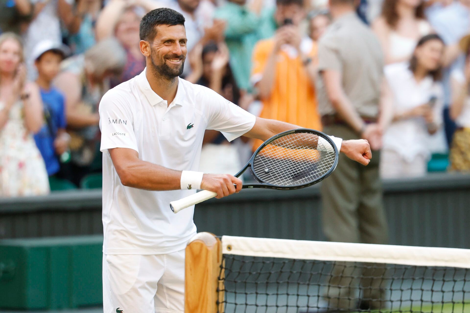 Novak Djokovic (SRB) dances on the court towards his daughter in the player's box after his match against Flavio Cobolli (ITA)(not pictured) in a gentlemen's singles quarter-final on day ten of these Championships Wimbledon 2025 at All England Lawn Tennis and Croquet Club.