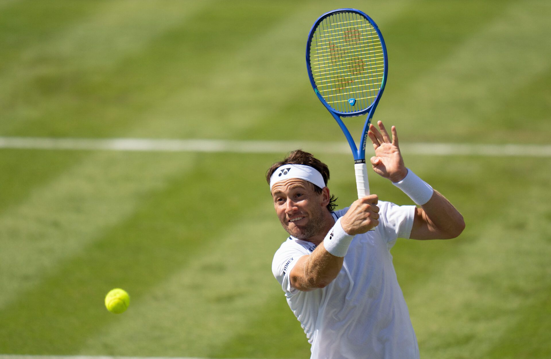 Casper Ruud of Norway returns a shot during his match against Hubert Hurkacz of Poland  on day one at Wimbledon.