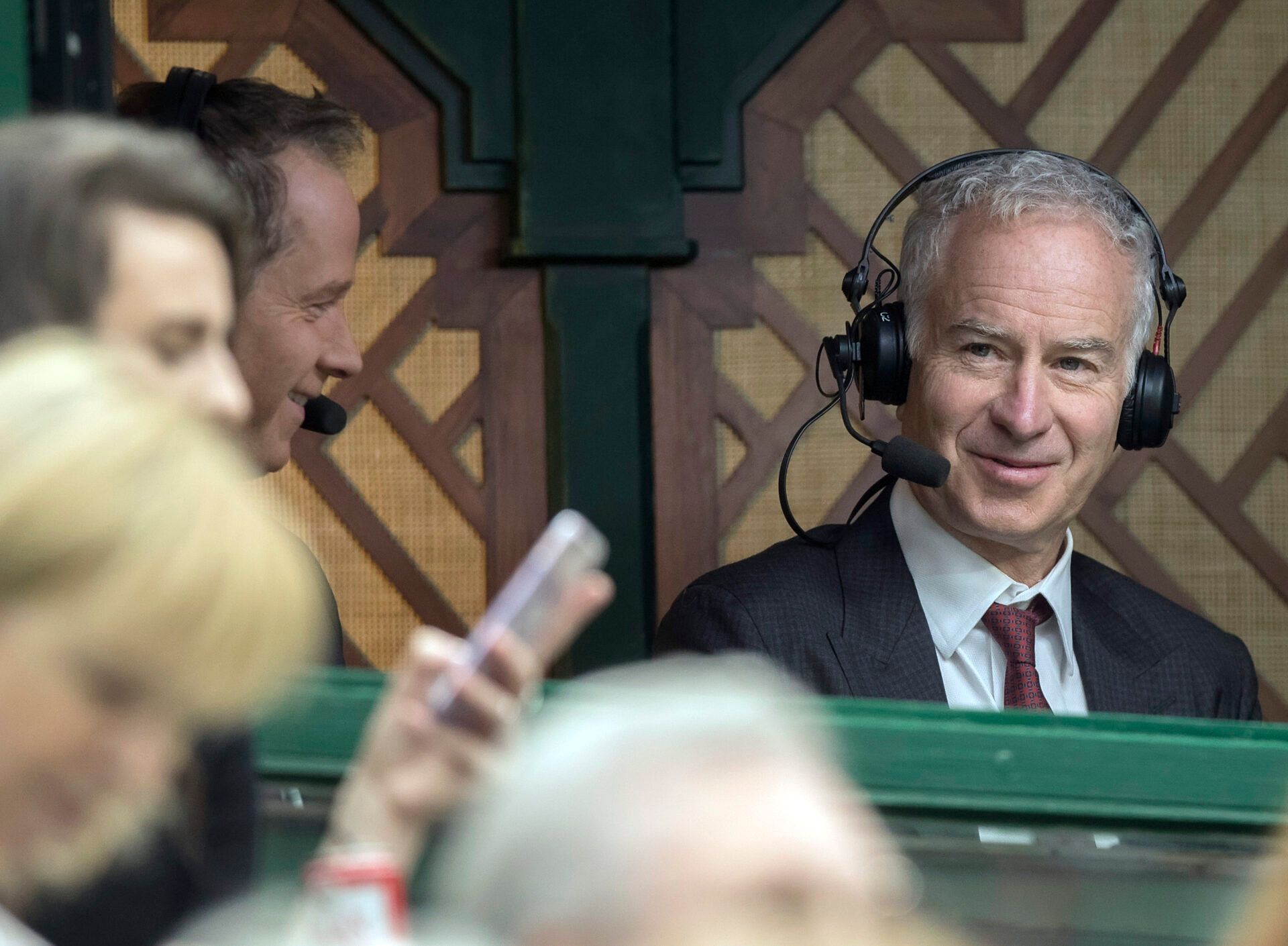 John McEnroe (R) in the commentary booth for one of Novak Djokovic's Wimbledon matches.