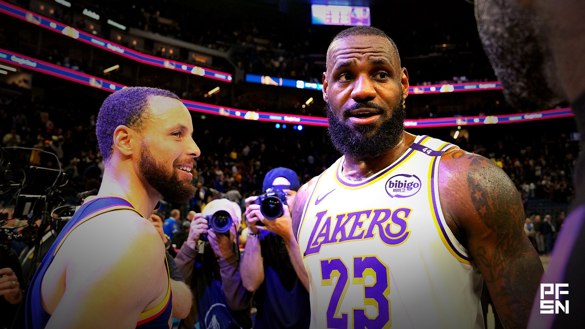 Los Angeles Lakers forward LeBron James (23) talks with Golden State Warriors guard Stephen Curry (left) and forward Draymond Green (right) after the game at Chase Center.