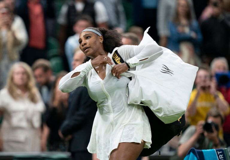 Serena Williams (USA) leaves the court after her first round match against Harmony Tan (FRA) on day two at All England Lawn Tennis and Croquet Club.