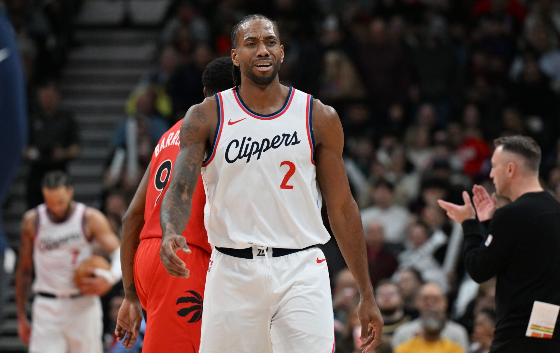 Los Angeles Clippers forward Kawhi Leonard (2) walks off the floor after time out was called in the second half against the Toronto Raptors at Scotiabank Arena.