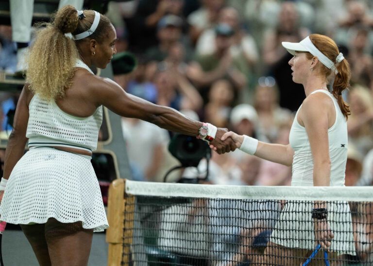Serena Williams of the United States and Maya Joint of Australia at the net after their match on day two at All England Lawn Tennis and Croquet Club.