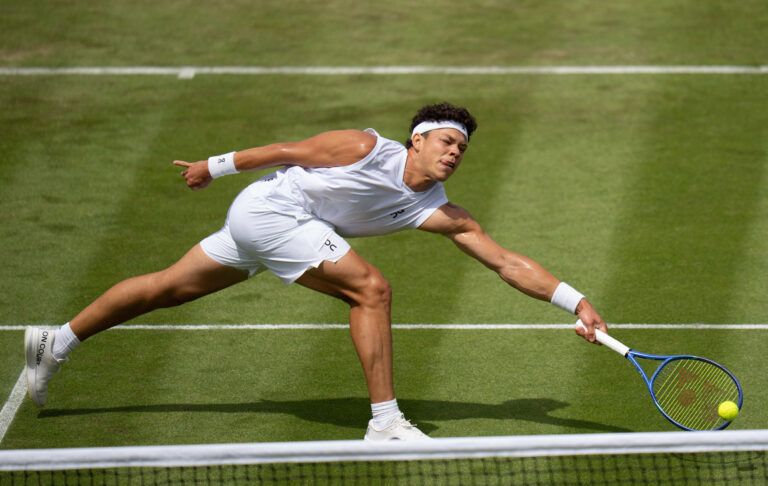 Ben Shelton of the United States returns a shot during his match against Otto Virtanen of Finland on day two at All England Lawn Tennis and Croquet Club.