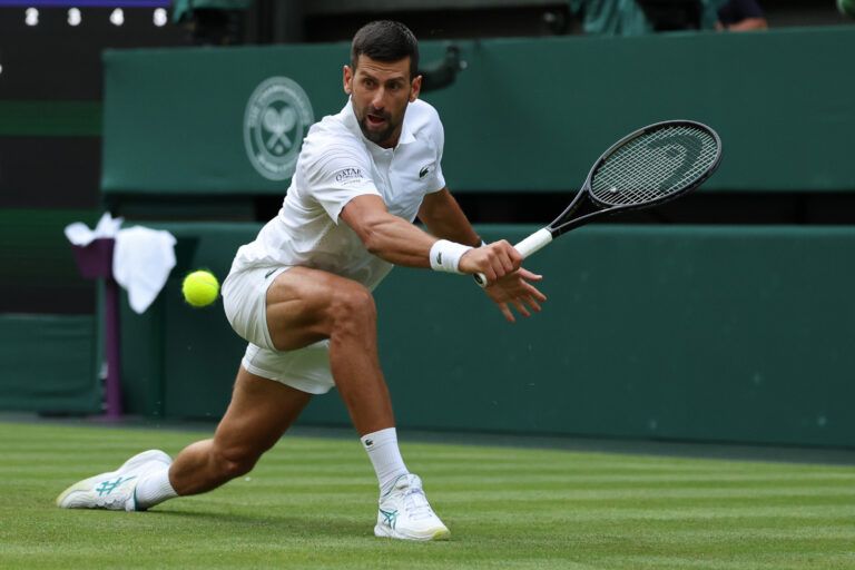 Novak Djokovic (SRB) reaches for a backhand against Yibing Wu (CHN) (not pictured) on day one of The Championships Wimbledon 2026  at All England Lawn Tennis and Croquet Club.