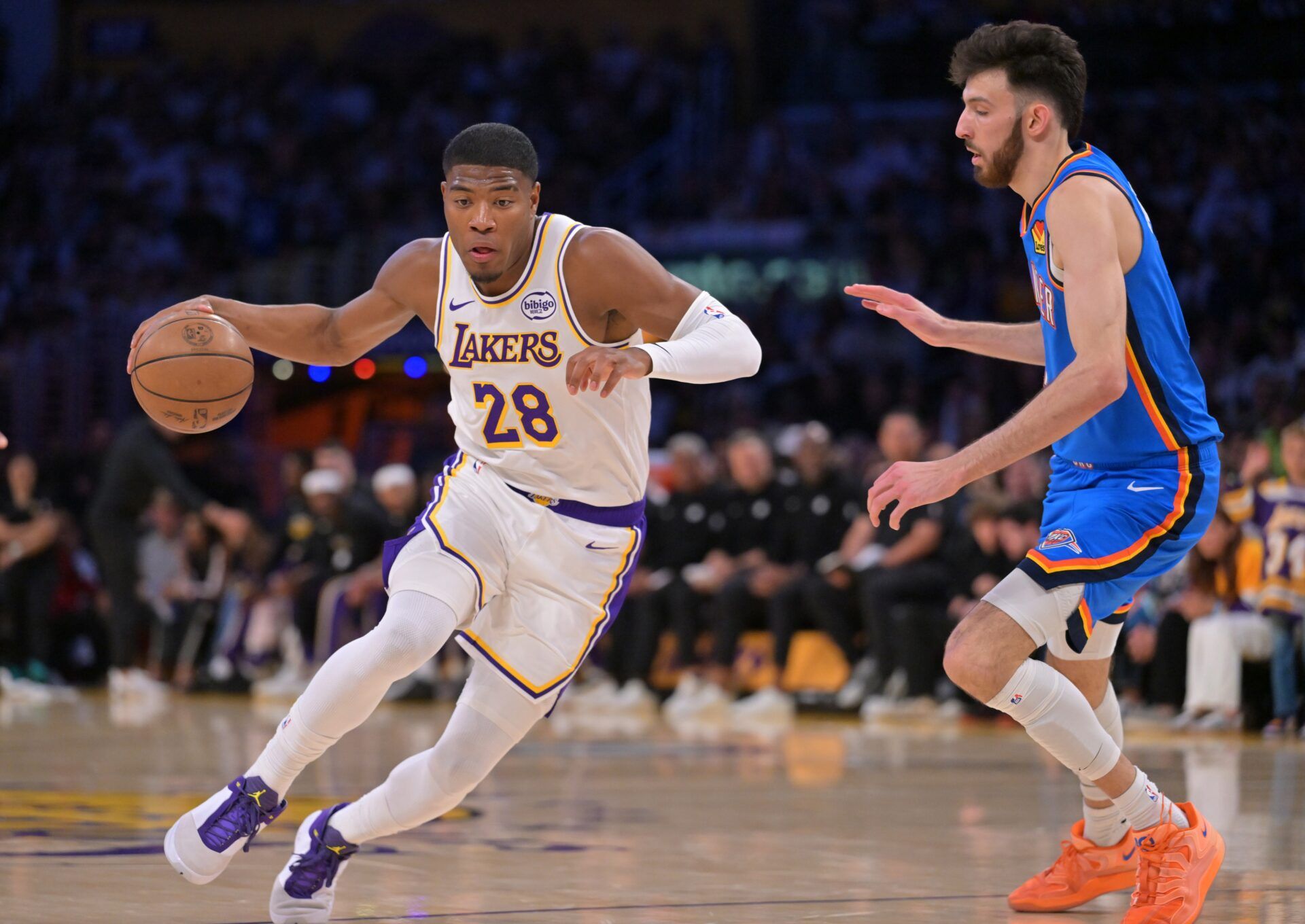 Los Angeles Lakers forward Rui Hachimura (28) is defended by Oklahoma City Thunder center Chet Holmgren (7) during the first quarter of game three of the second round of the 2026 NBA Playoffs at Crypto.com Arena.