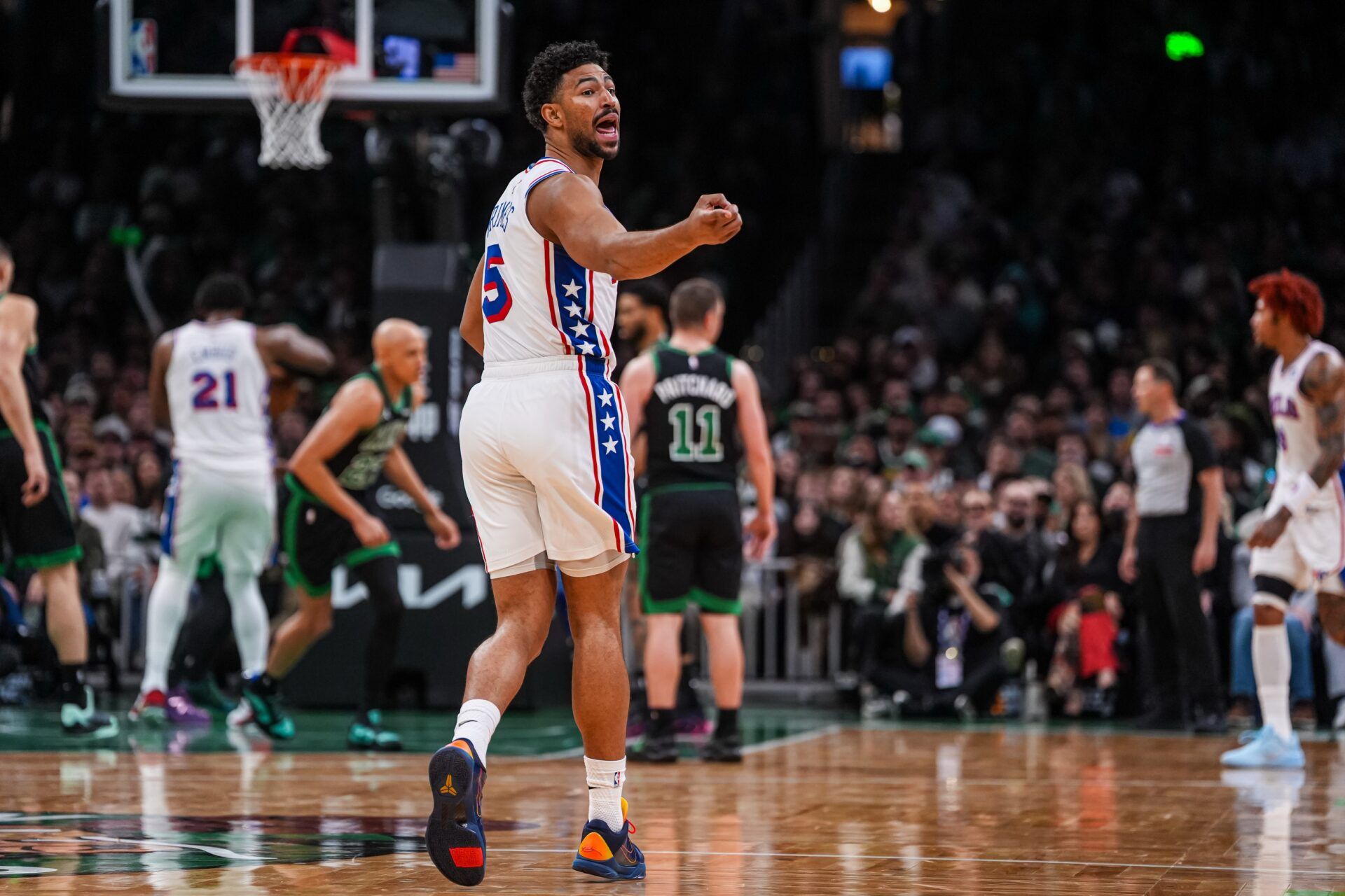Philadelphia 76ers guard Quentin Grimes (5) reacts to his bench after his three point basket against the Boston Celtics in the second half during game five of the first round of the 2026 NBA Playoffs at TD Garden.