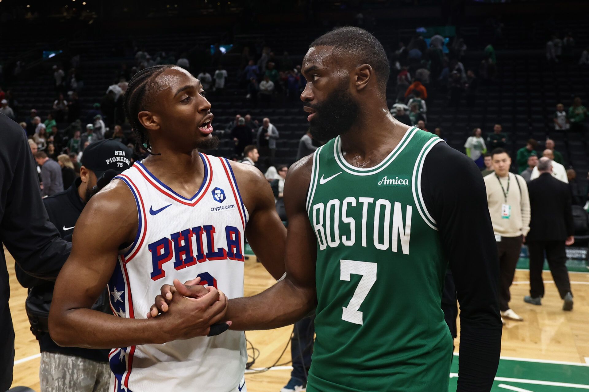 Philadelphia 76ers guard Tyrese Maxey (0) talks with Boston Celtics guard Jaylen Brown (7)after PhiladephiaÕs win in game seven of the first round of the 2026 NBA Playoffs at TD Garden.