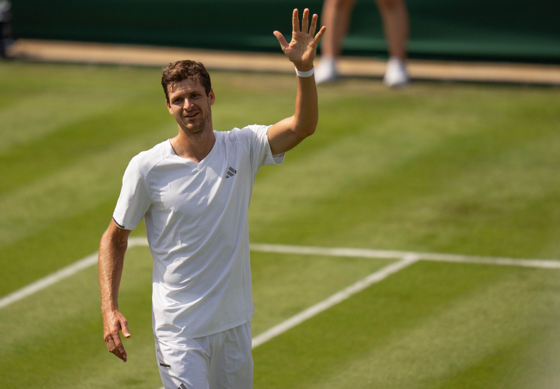Hubert Hurkacz of Poland celebrates winning his match against Casper Ruud of Norway on day one at All England Lawn Tennis and Croquet Club.